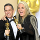 Lee Unkrich and producer Darla K. Anderson, holding their Oscars for Coco.